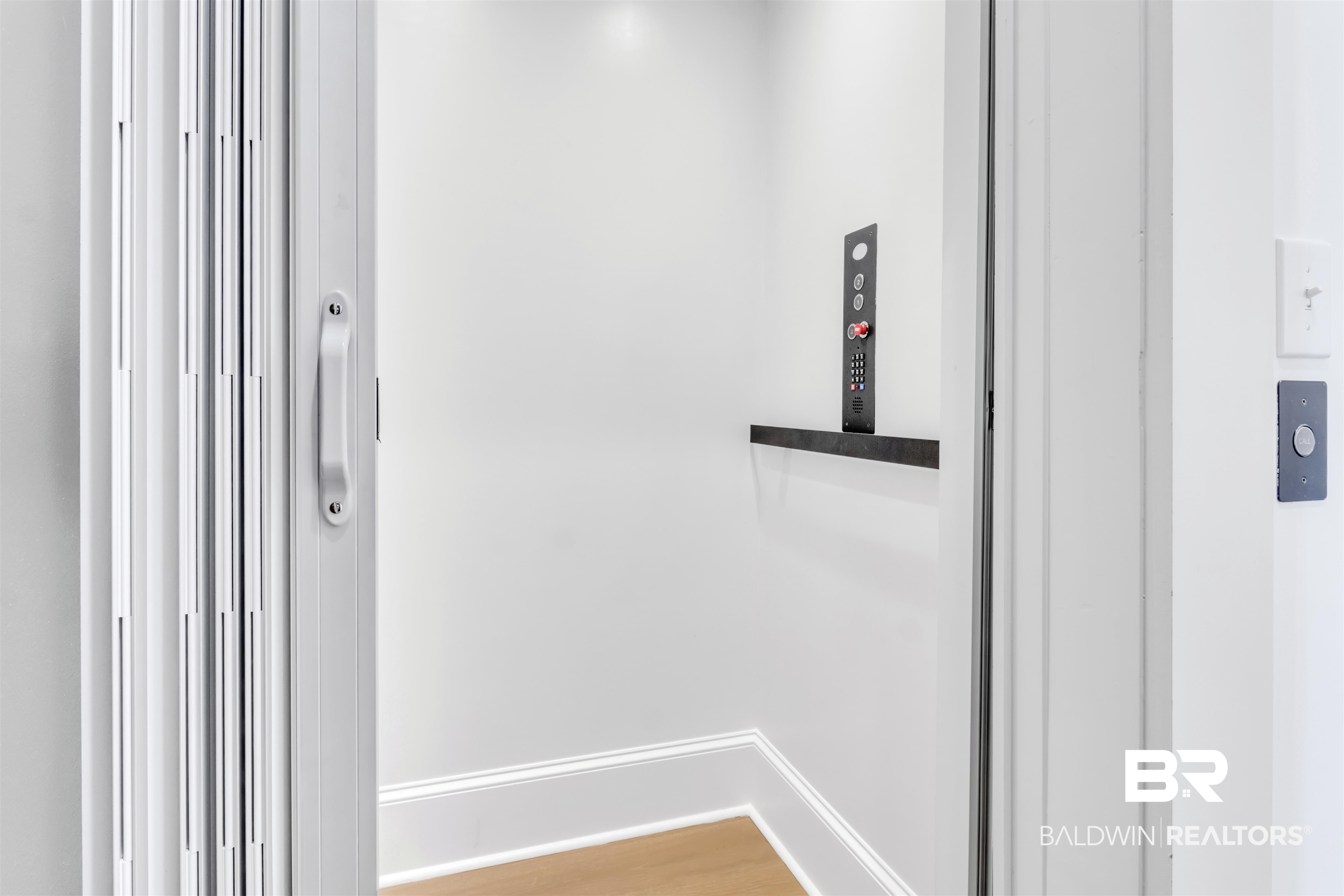 885 Inlet Circle Gulf Shores, AL 36542 - Photo 17 of 36 Room details with wood-type flooring and elevator