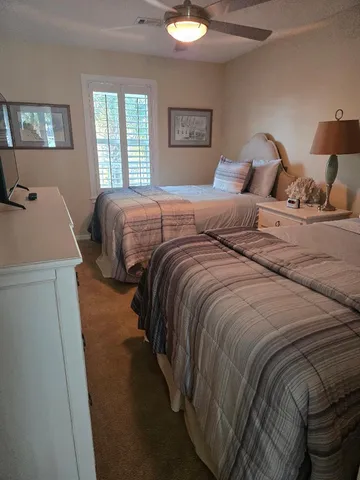 a bedroom with a bed and a lamp