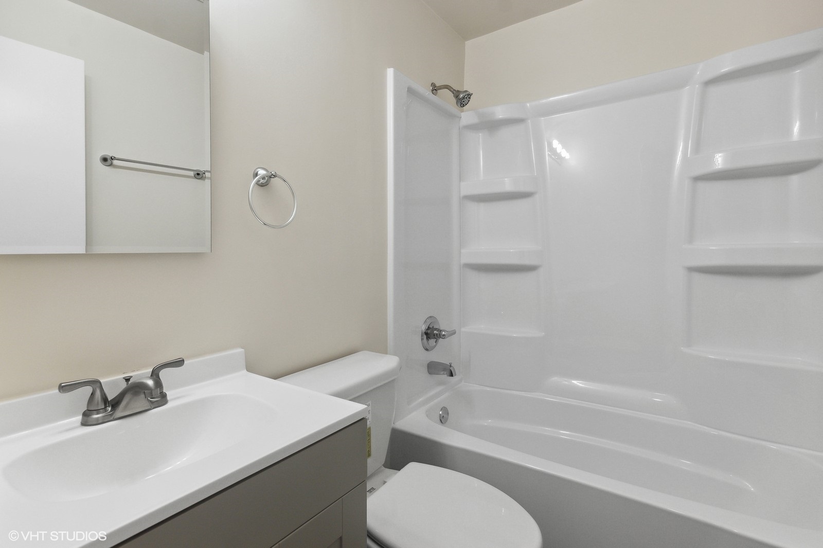 755 South Nelson Avenue, Unit 7 Kankakee, IL 60901 - Photo 7 of 9 a bathroom with a sink toilet vanity and shower