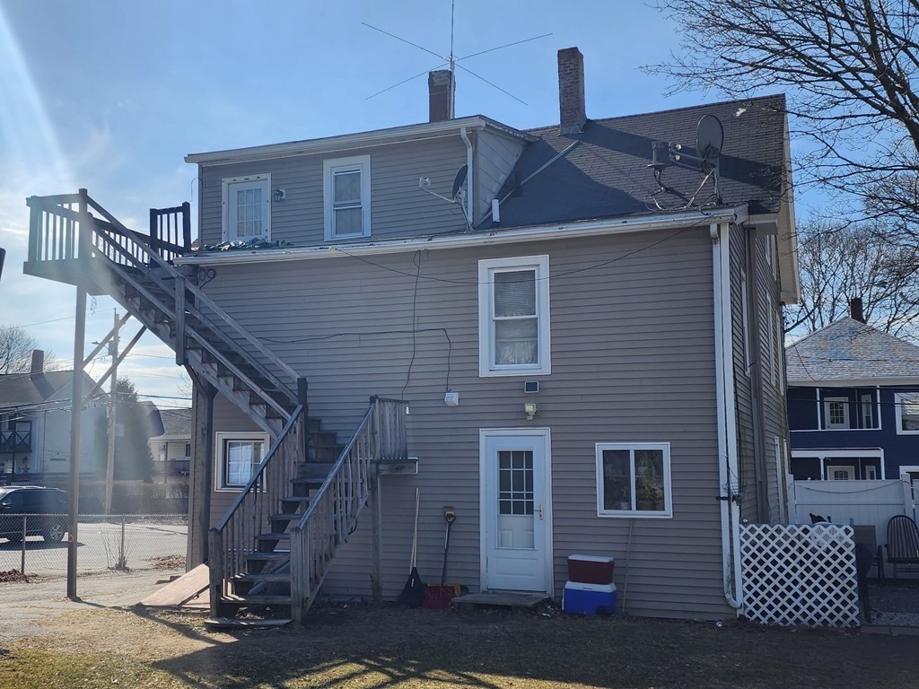 61 Whitcomb Street Webster, MA 01570 - Photo 2 of 7 a front view of a house with a yard
