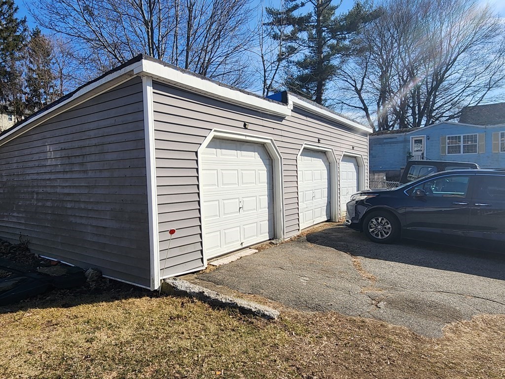 61 Whitcomb Street Webster, MA 01570 - Photo 3 of 7 a view of a car garage