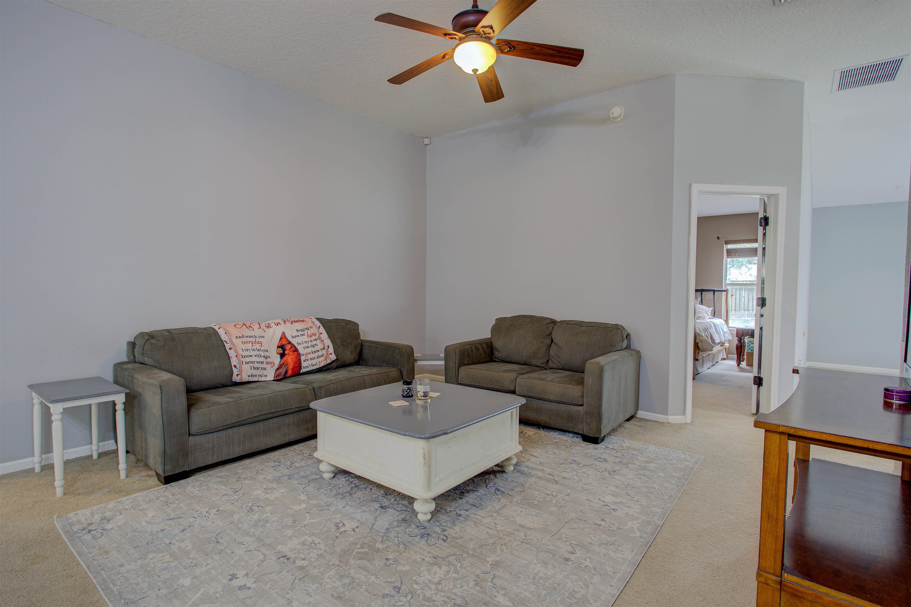 939 Silver Spring Court St. Augustine, FL 32092 - Photo 17 of 79 a living room with couch and a ceiling fan
