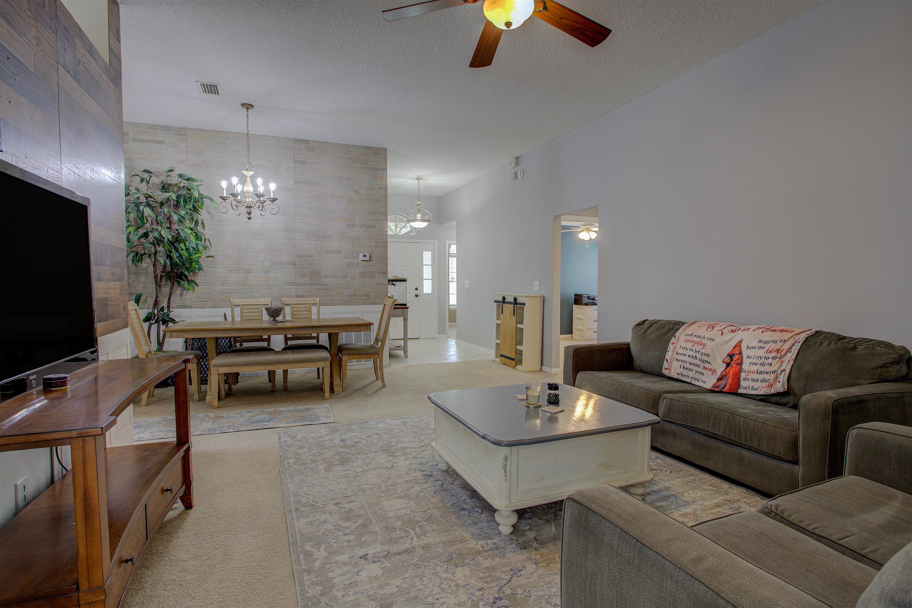 939 Silver Spring Court St. Augustine, FL 32092 - Photo 19 of 79 a living room with furniture and a flat screen tv