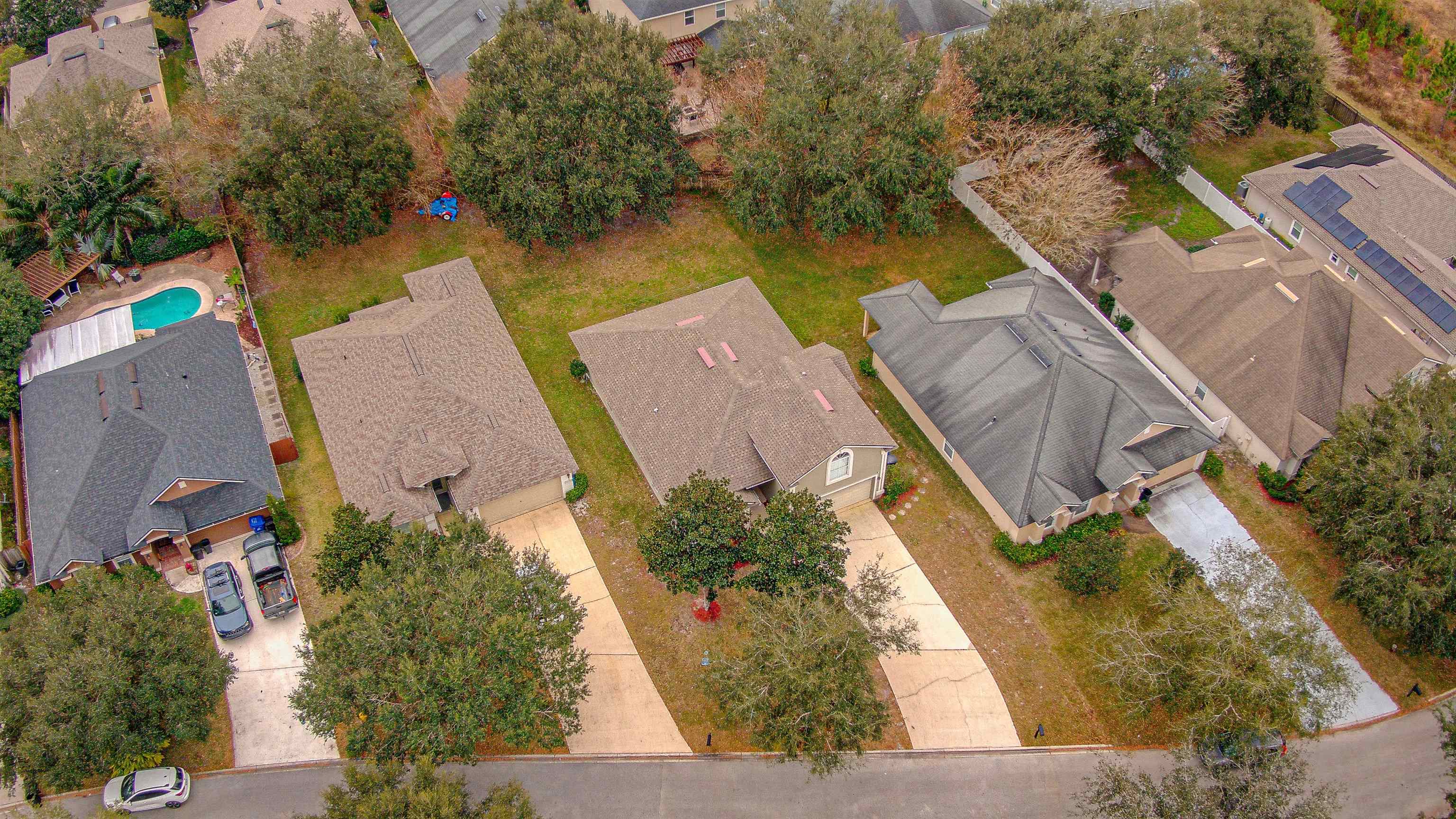939 Silver Spring Court St. Augustine, FL 32092 - Photo 4 of 79 an aerial view of a house with swimming pool and large trees