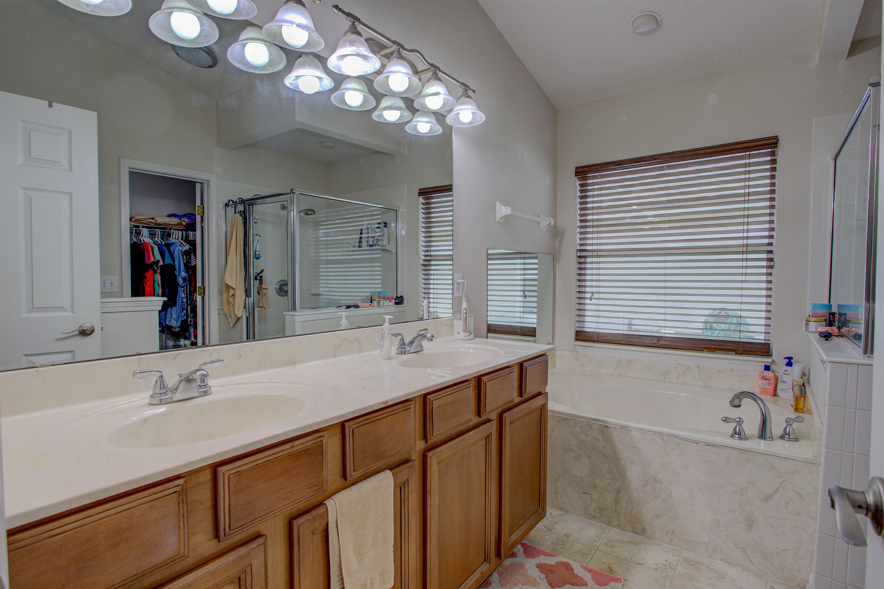 939 Silver Spring Court St. Augustine, FL 32092 - Photo 50 of 79 a bathroom with a sink double vanity and a mirror