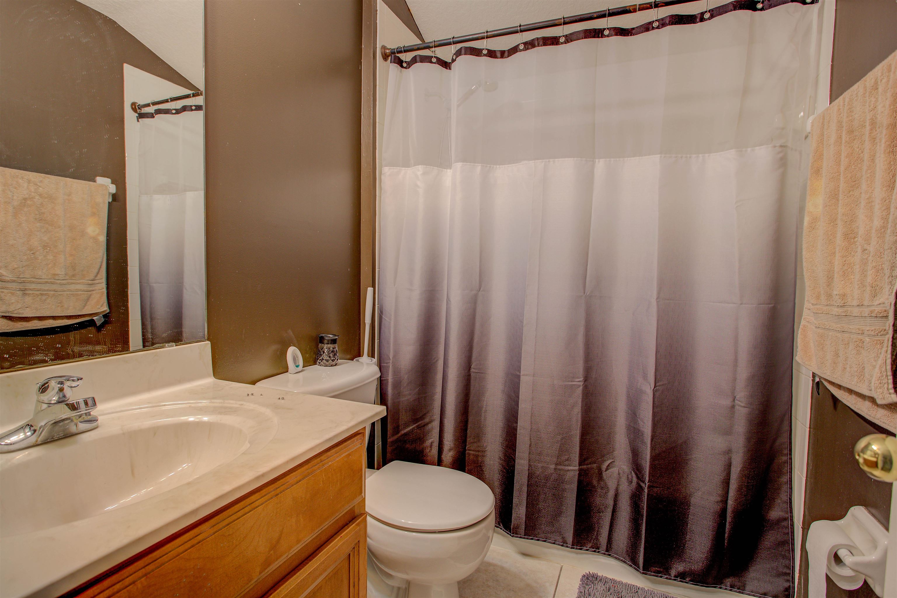 939 Silver Spring Court St. Augustine, FL 32092 - Photo 59 of 79 a bathroom with a sink a toilet and a mirror
