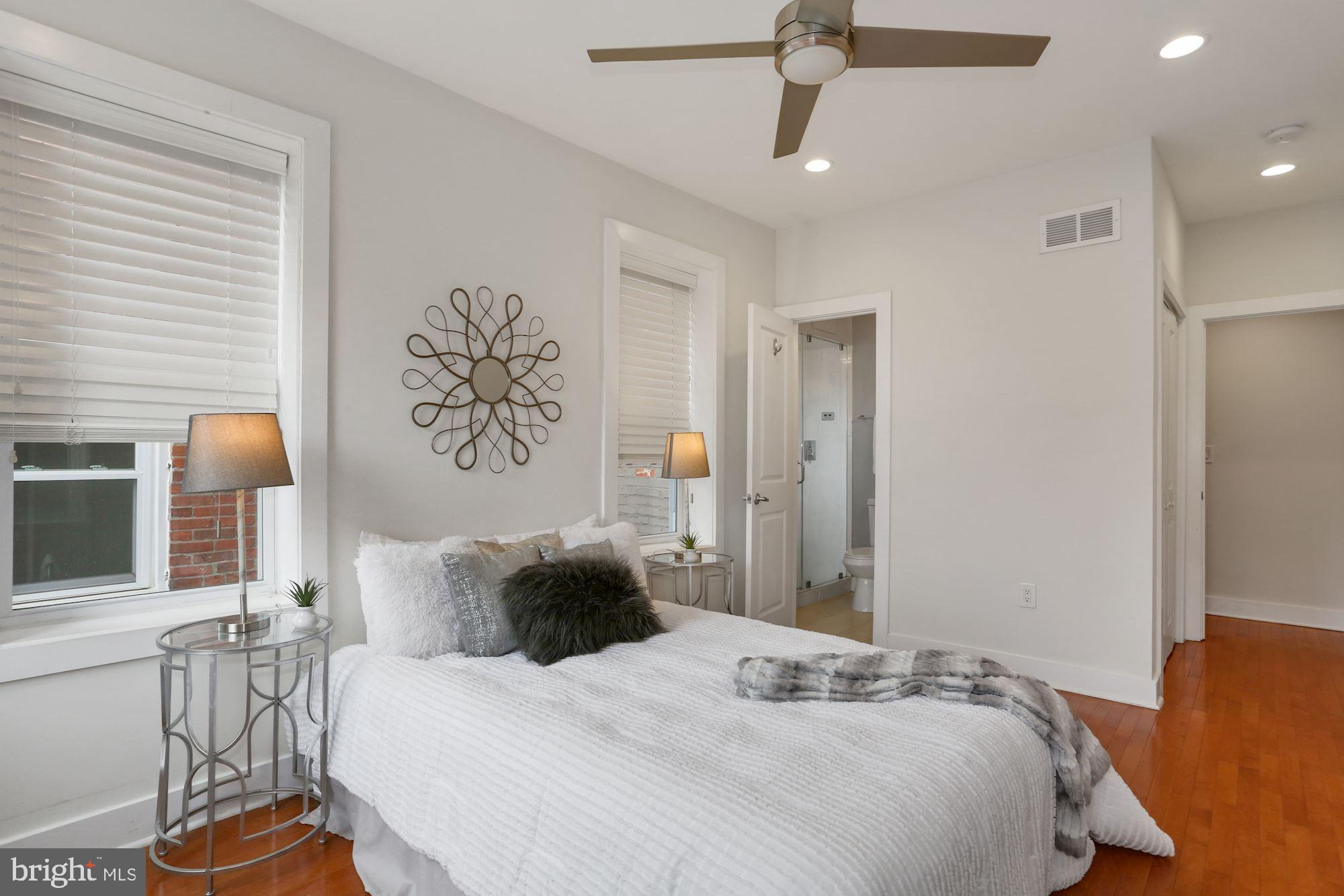 43 Hanover Place Northwest, Unit 1 Washington, DC 20001 - Photo 14 of 23 a bedroom with a bed dresser and a window