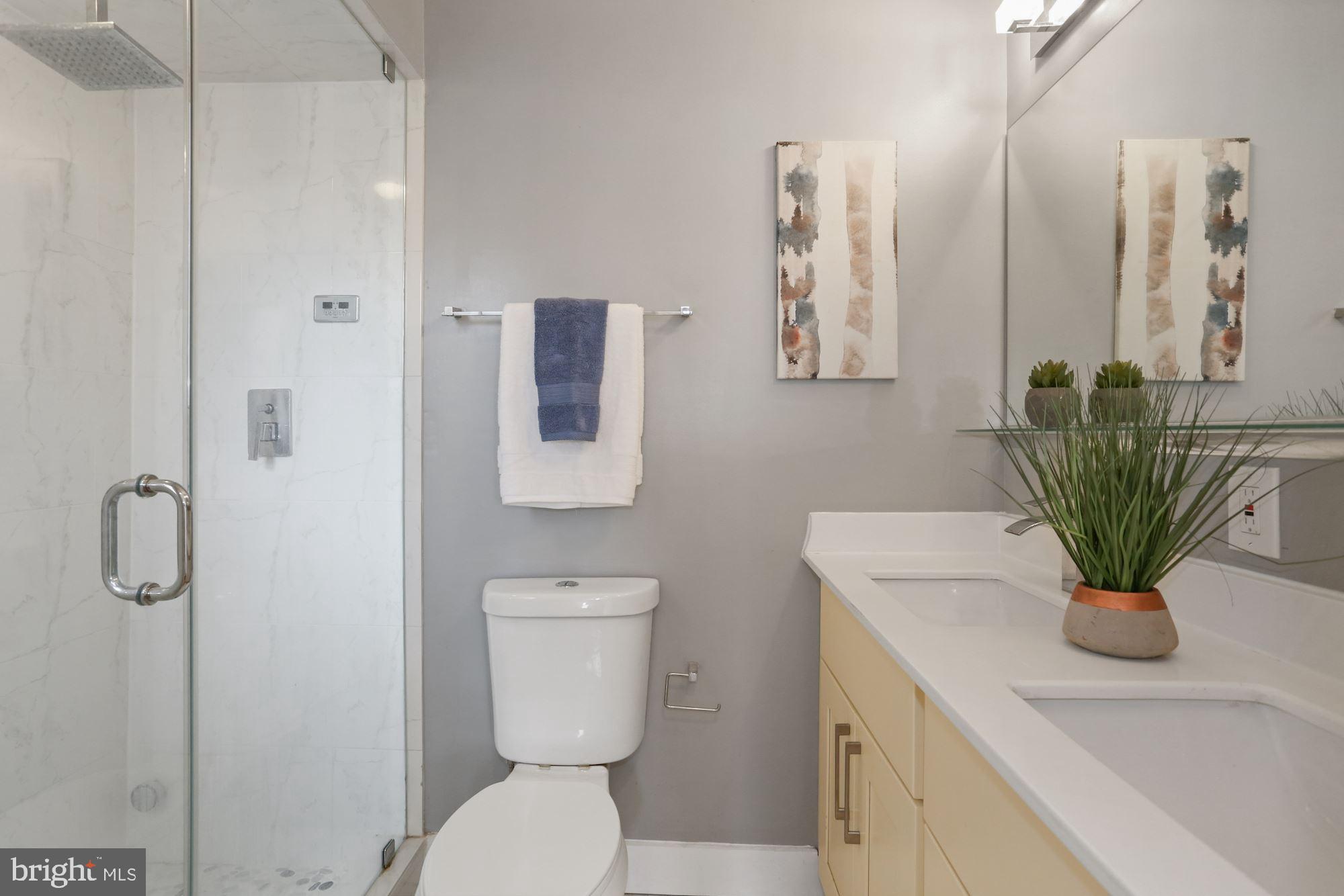 43 Hanover Place Northwest, Unit 1 Washington, DC 20001 - Photo 16 of 23 a bathroom with a toilet a sink and mirror
