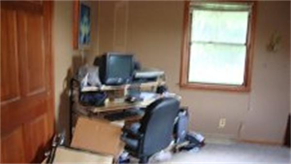 22 Mendall Road Acushnet, MA 02743 - Photo 6 of 14 a room with a chair and a window