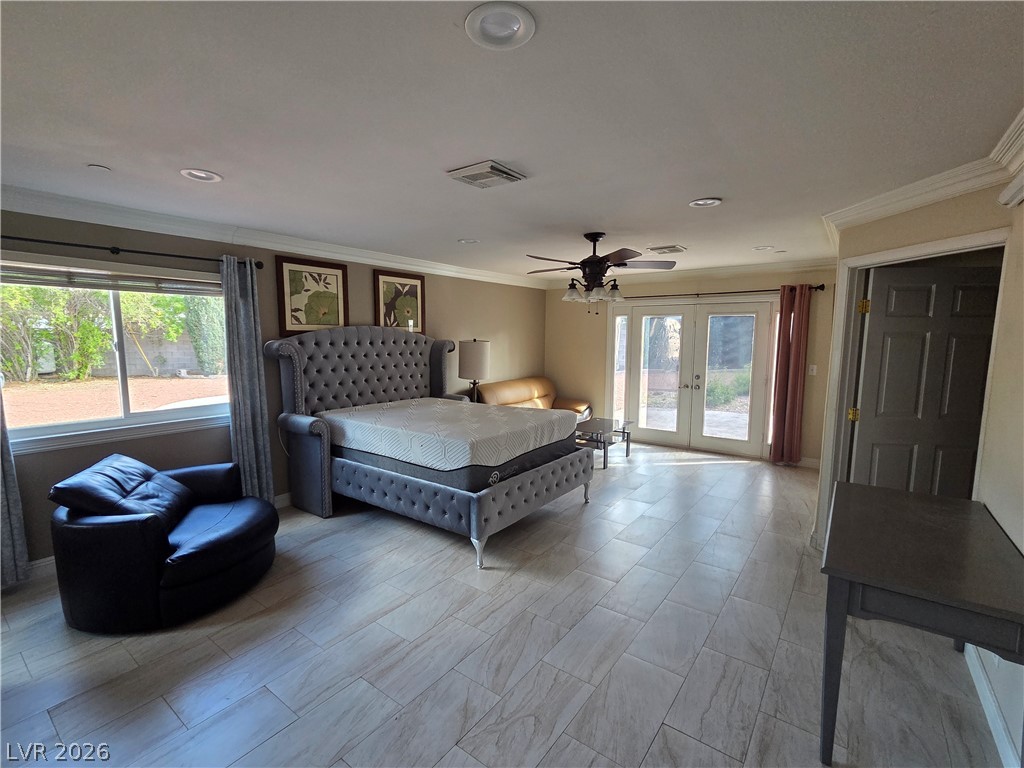 3381 Westwind Road Las Vegas, NV 89146 - Photo 39 of 52 Step into this generous primary bedroom, featuring dual French doors leading to outdoor leisure.