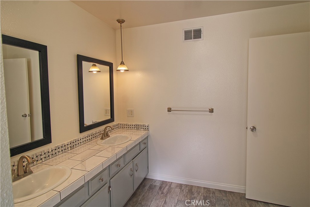 1235 Ruby Lane Calimesa, CA 92320 - Photo 14 of 17 a bathroom with a sink and a mirror