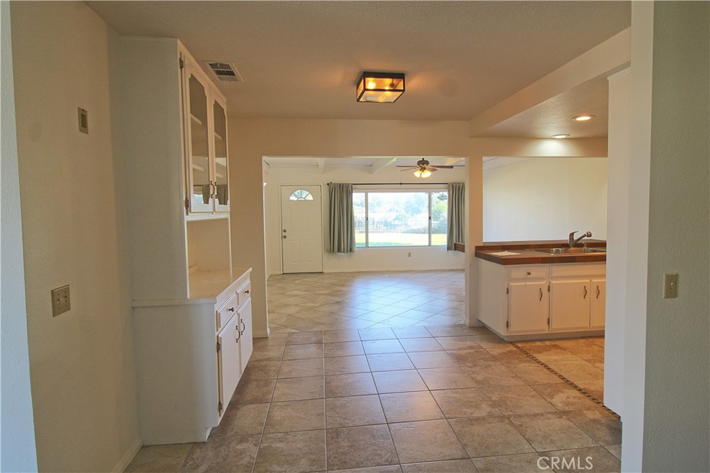 1235 Ruby Lane Calimesa, CA 92320 - Photo 5 of 17 a view of a kitchen cabinets and empty room