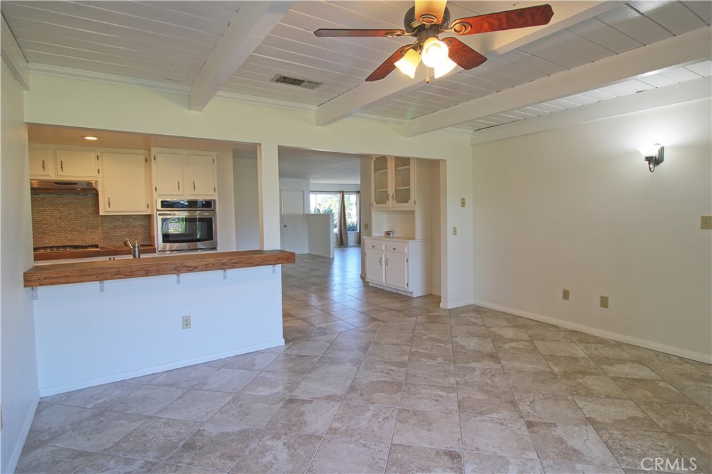 1235 Ruby Lane Calimesa, CA 92320 - Photo 8 of 17 a view of a kitchen with a sink and cabinets