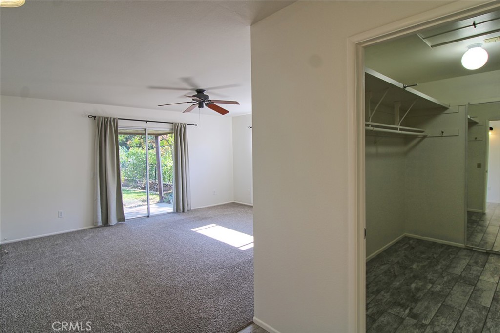 1235 Ruby Lane Calimesa, CA 92320 - Photo 10 of 17 a view of a room with a ceiling fan and shower