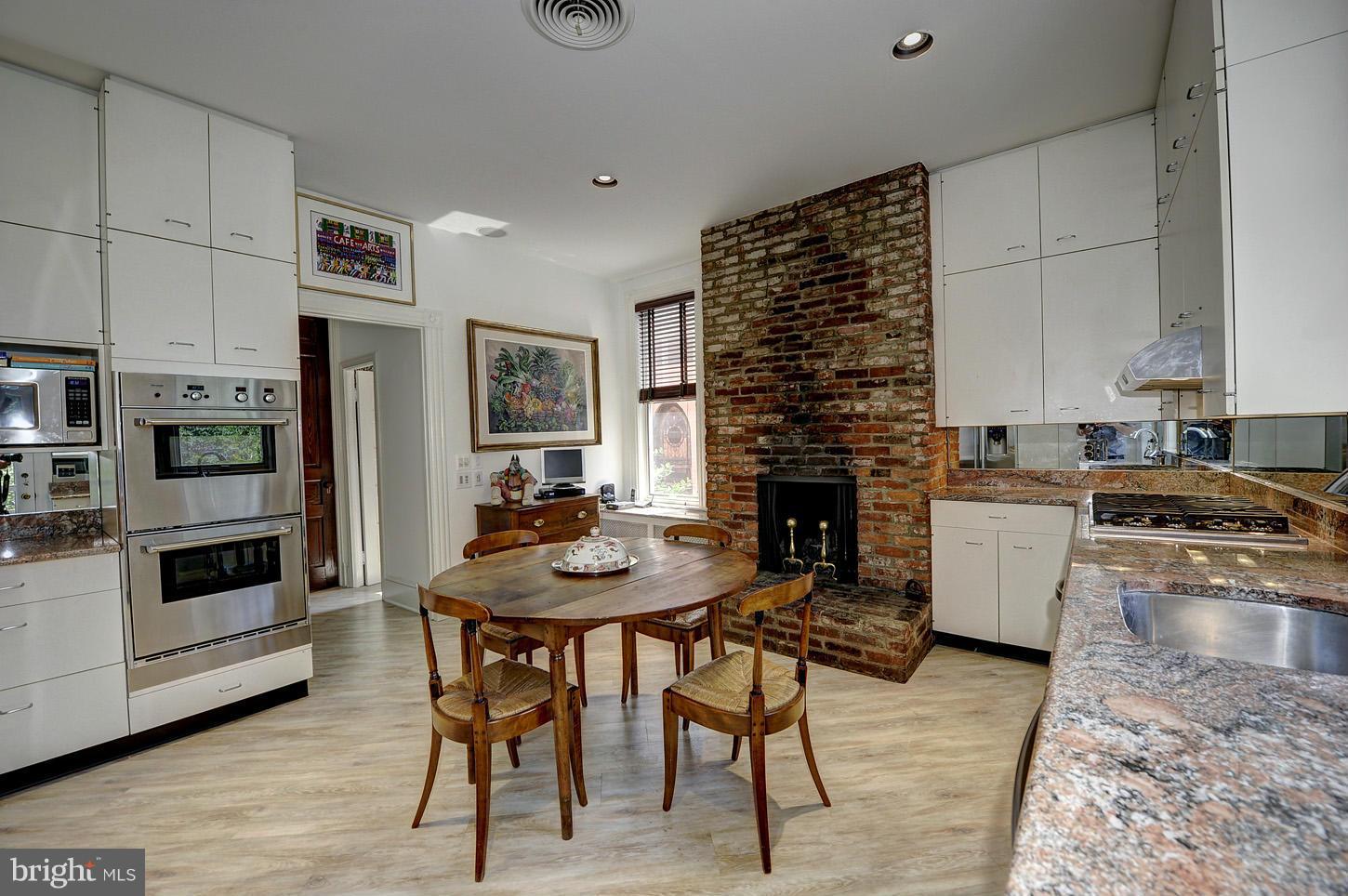 3040 Q Street Northwest Washington, DC 20007 - Photo 11 of 30 Kitchen with wood burning fireplace