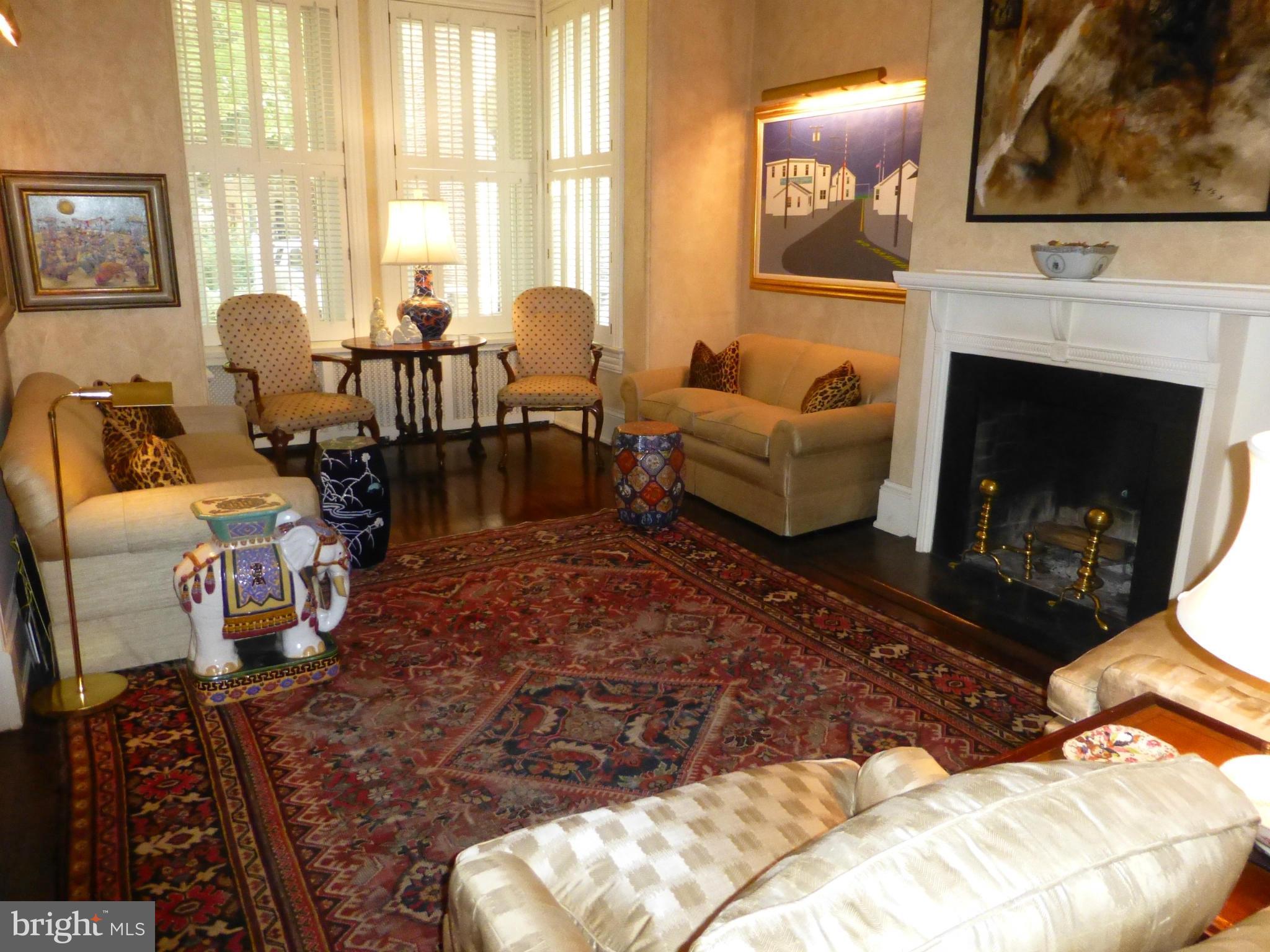 3040 Q Street Northwest Washington, DC 20007 - Photo 5 of 30 Living Room with wood burning fireplace