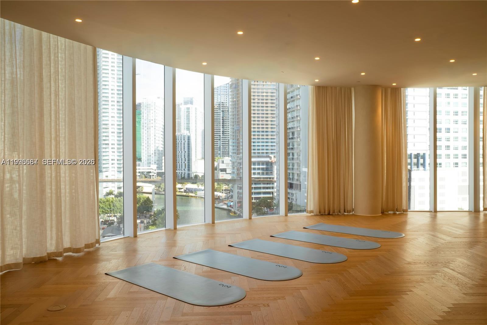 275 Southwest 6th Street, Unit 1110 Miami, FL 33130 - Photo 12 of 22 a view of an empty room with wooden floor and a window