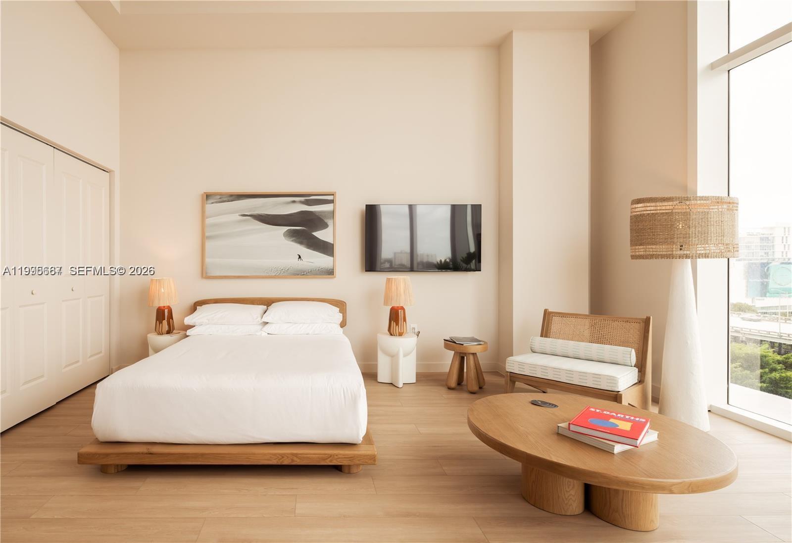 275 Southwest 6th Street, Unit 1110 Miami, FL 33130 - Photo 6 of 22 a bedroom with a bed and a couch