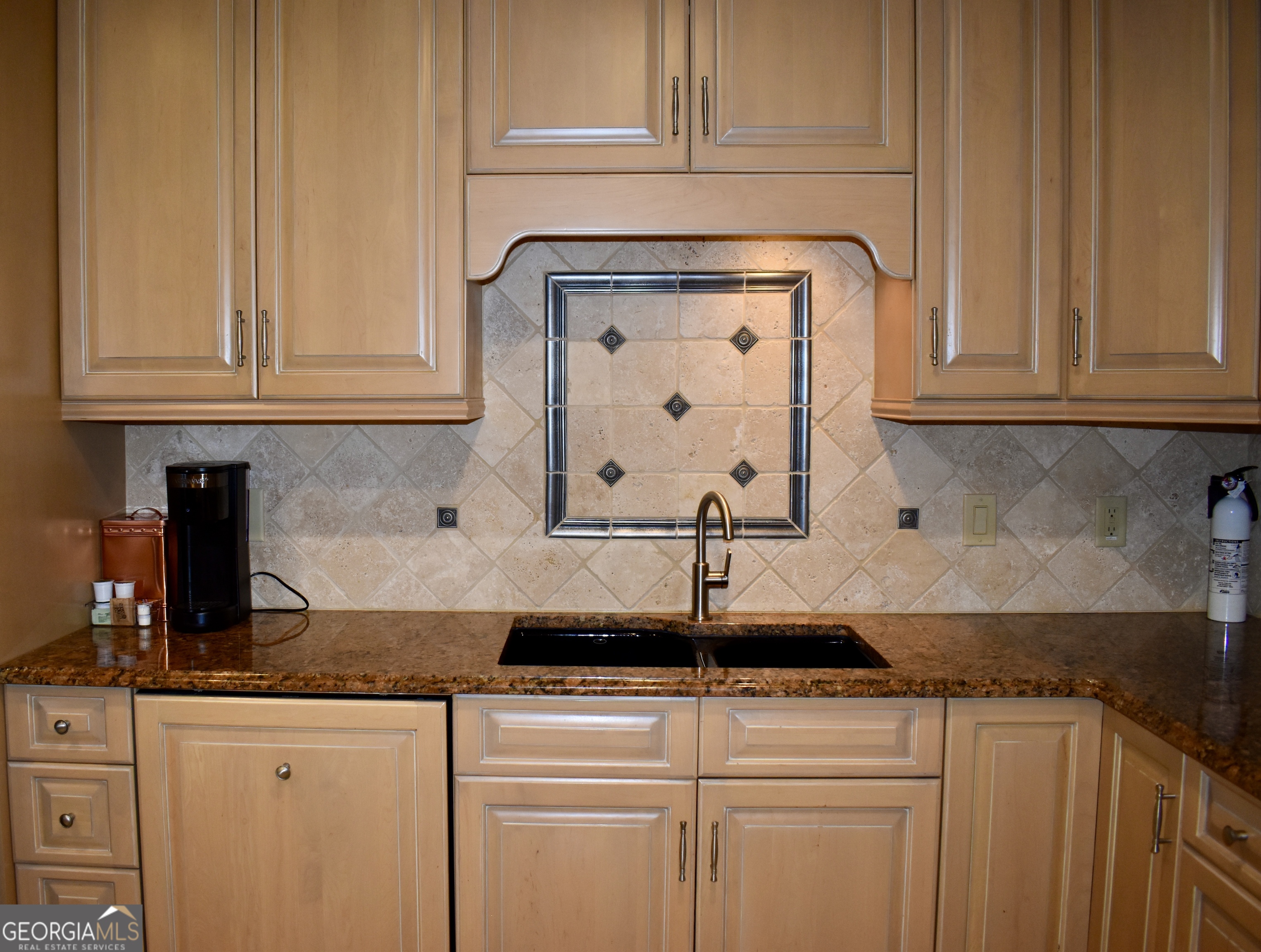3 Club Drive Newnan, GA 30263 - Photo 17 of 43 a kitchen with stainless steel appliances granite countertop a sink and cabinets