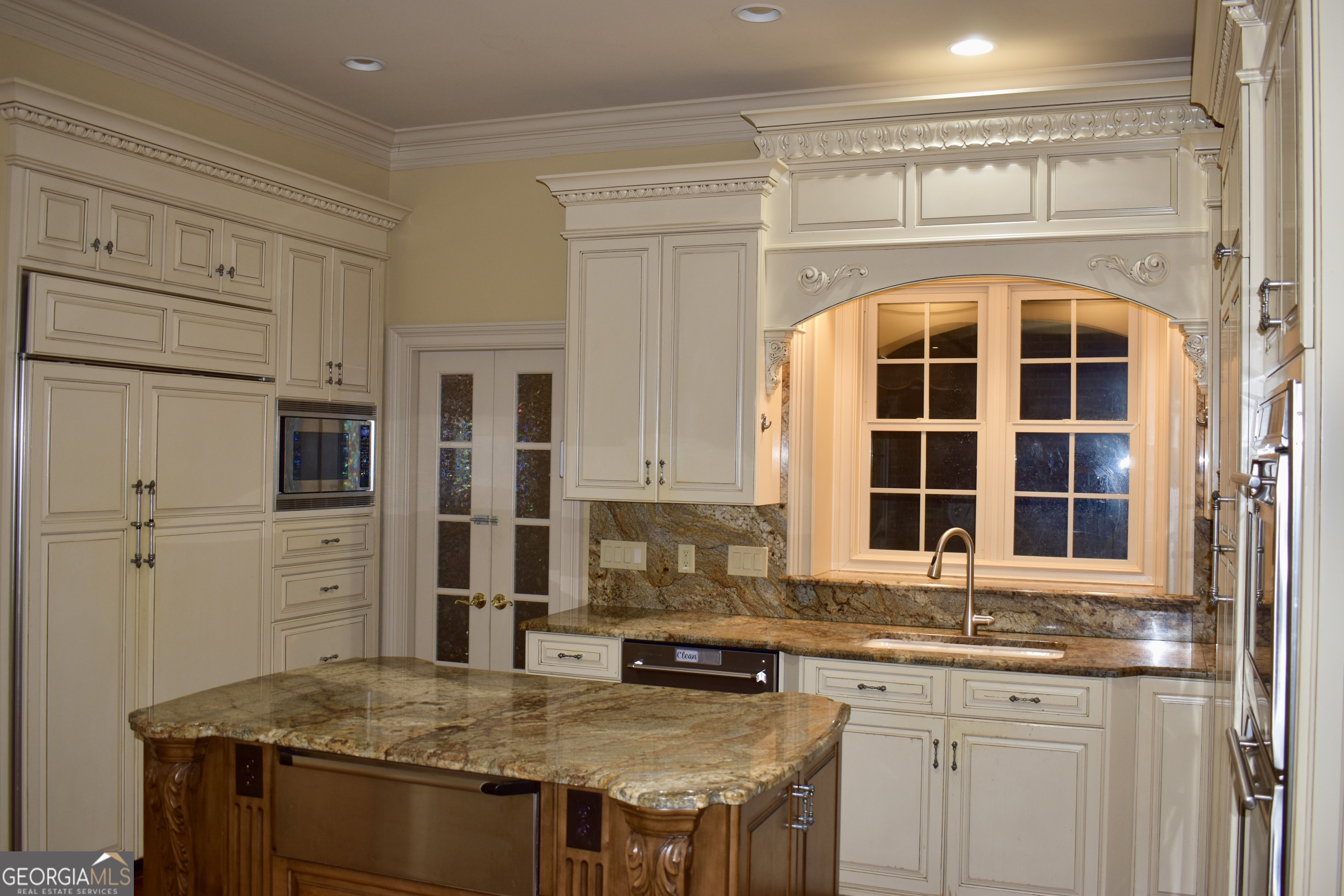 3 Club Drive Newnan, GA 30263 - Photo 30 of 43 a kitchen with stainless steel appliances granite countertop a stove and cabinets