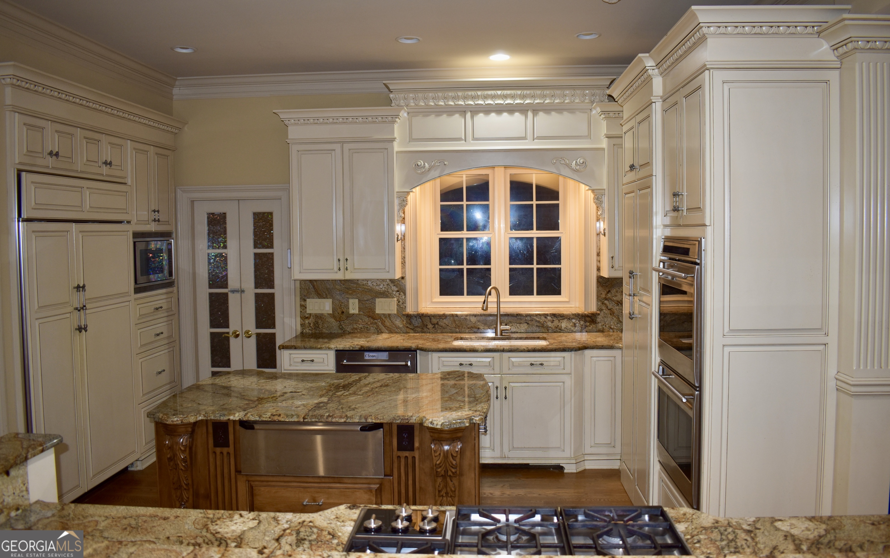 3 Club Drive Newnan, GA 30263 - Photo 31 of 43 a kitchen with stainless steel appliances granite countertop a stove and a refrigerator