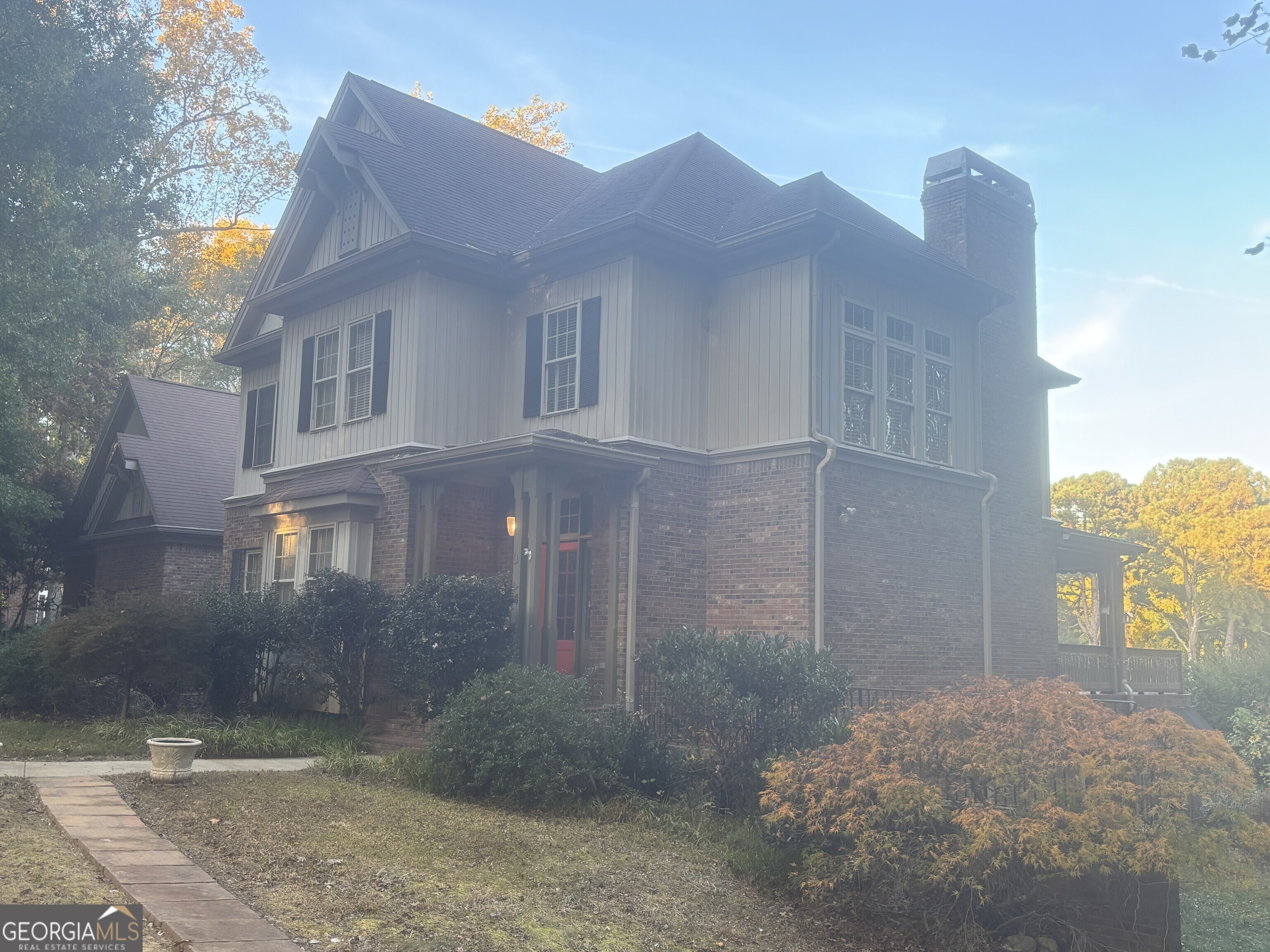 3 Club Drive Newnan, GA 30263 - Photo 4 of 43 a view of a brick house with many windows