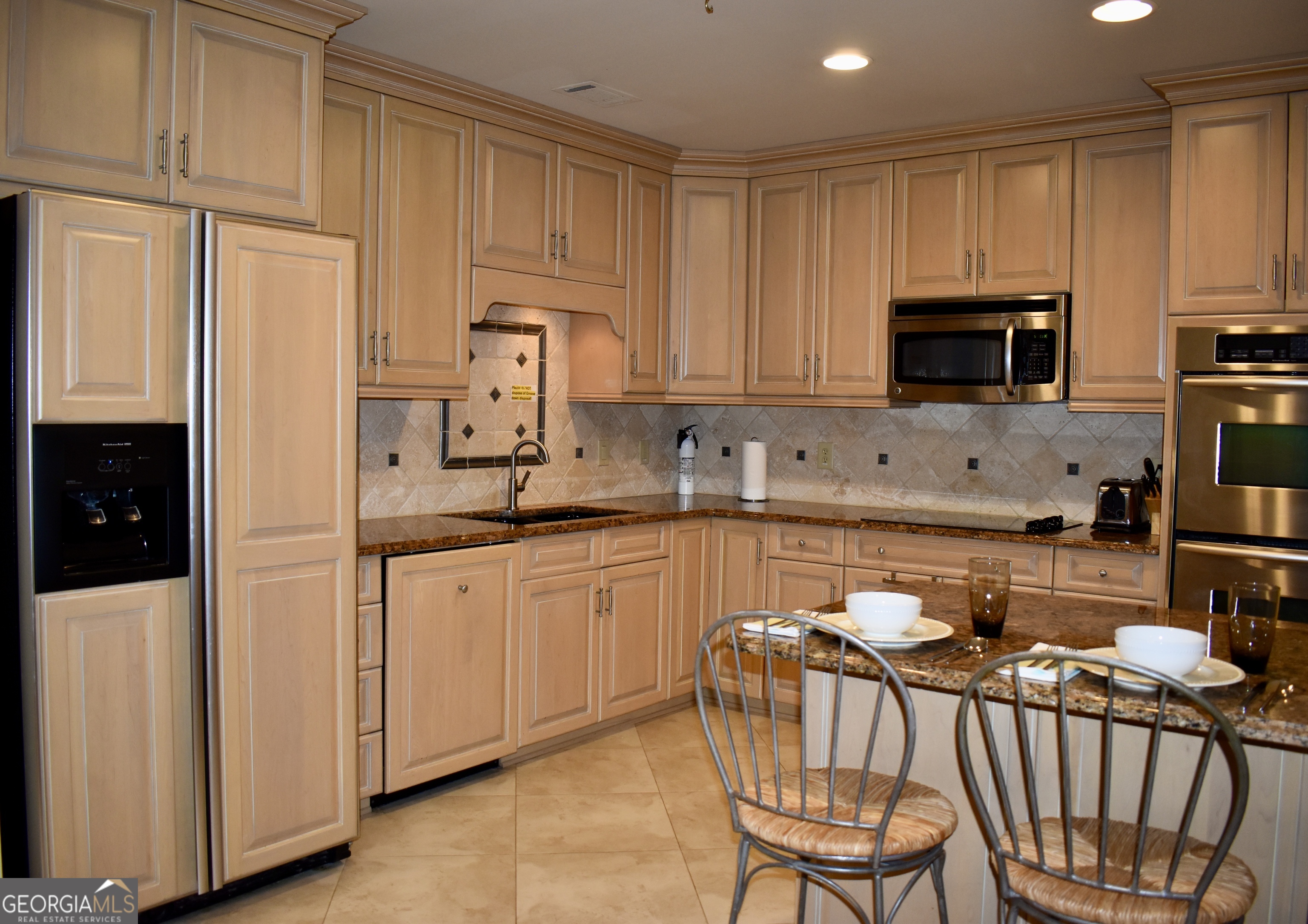 3 Club Drive Newnan, GA 30263 - Photo 10 of 43 a kitchen with stainless steel appliances granite countertop a stove a sink a microwave and a refrigerator