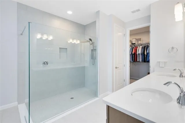 a bathroom with a bathtub and a shower