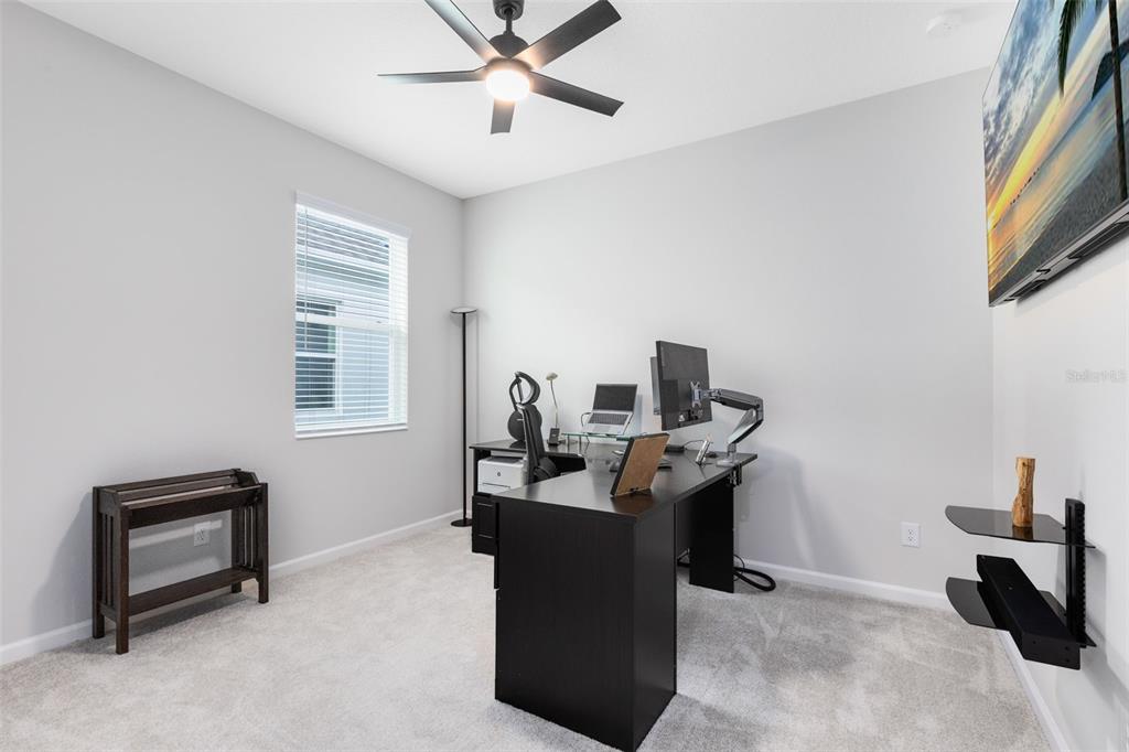 5229 Prairie Preserve Run St. Cloud, FL 34772 - Photo 22 of 36 a view of a workspace with furniture and a window