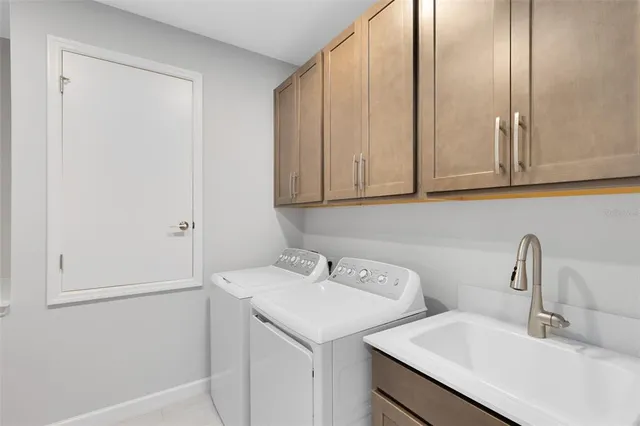 a bathroom with a sink and cabinets