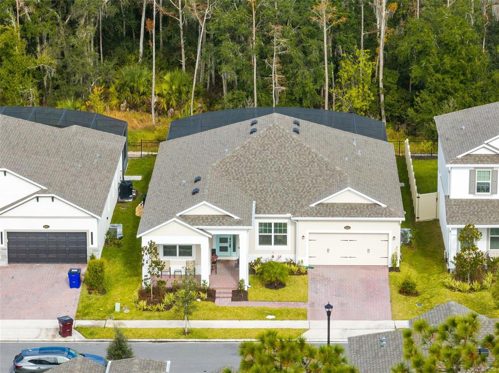 5229 Prairie Preserve Run St. Cloud, FL 34772 - Photo 3 of 36 an aerial view of a house with swimming pool garden and patio
