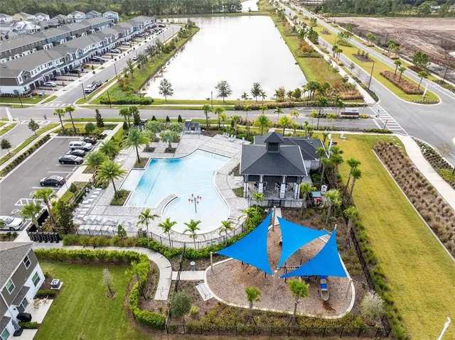 an aerial view of a house with a swimming pool