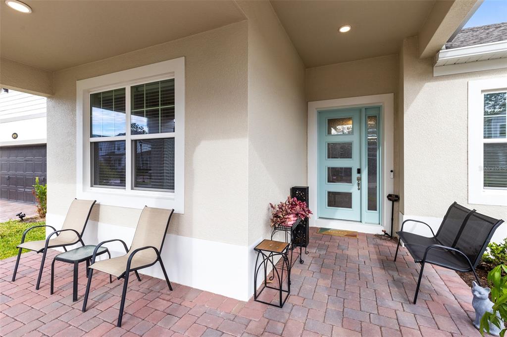 5229 Prairie Preserve Run St. Cloud, FL 34772 - Photo 4 of 36 a view of a dining room with furniture and front door