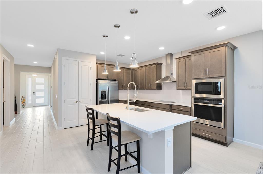 5229 Prairie Preserve Run St. Cloud, FL 34772 - Photo 8 of 36 a kitchen with a table and chairs in it