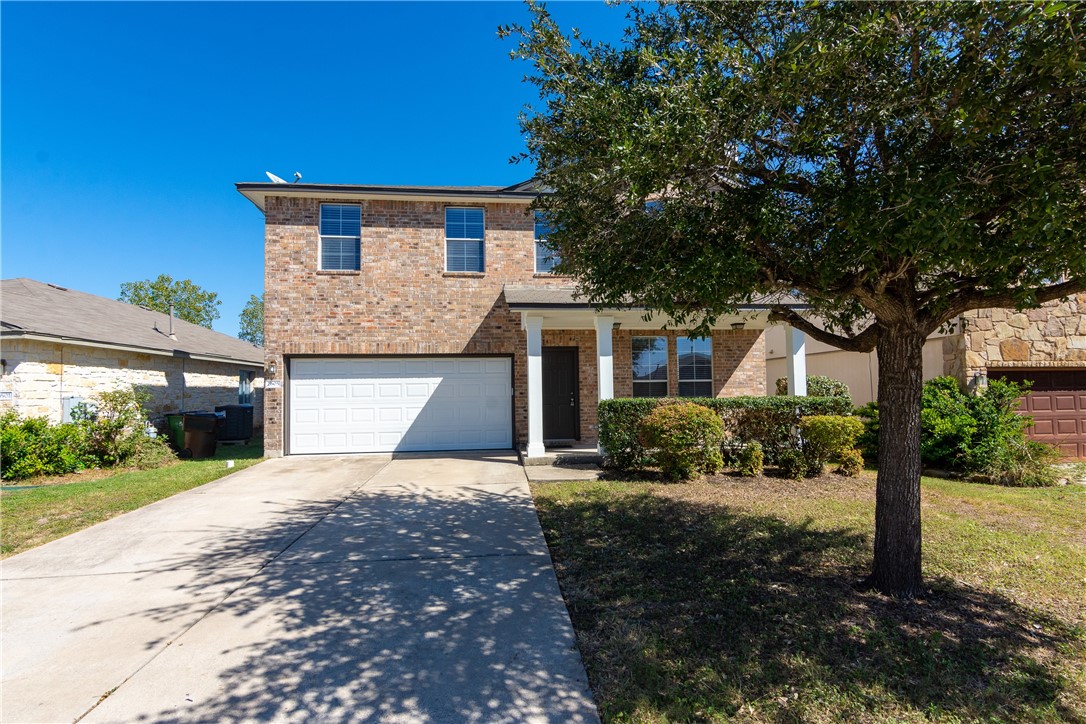 2605 Summerwalk Place Round Rock, TX 78665 - Photo 1 of 37 a front view of a house with a yard and garage