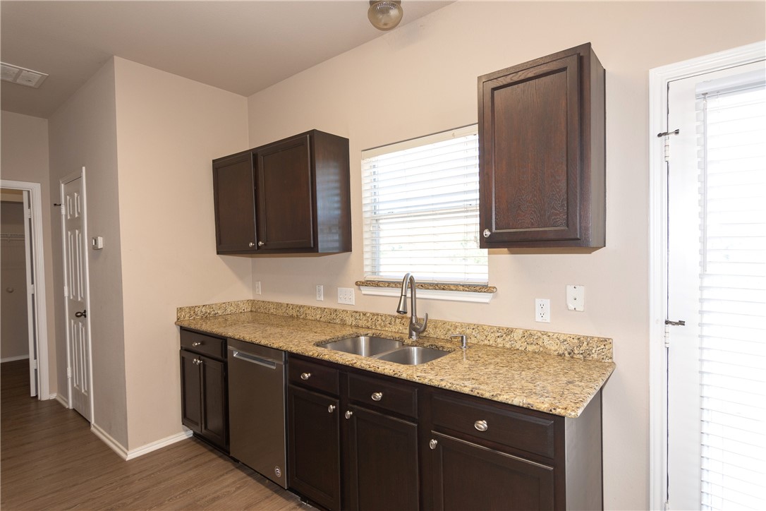2605 Summerwalk Place Round Rock, TX 78665 - Photo 17 of 37 a bathroom with a granite countertop sink and a mirror