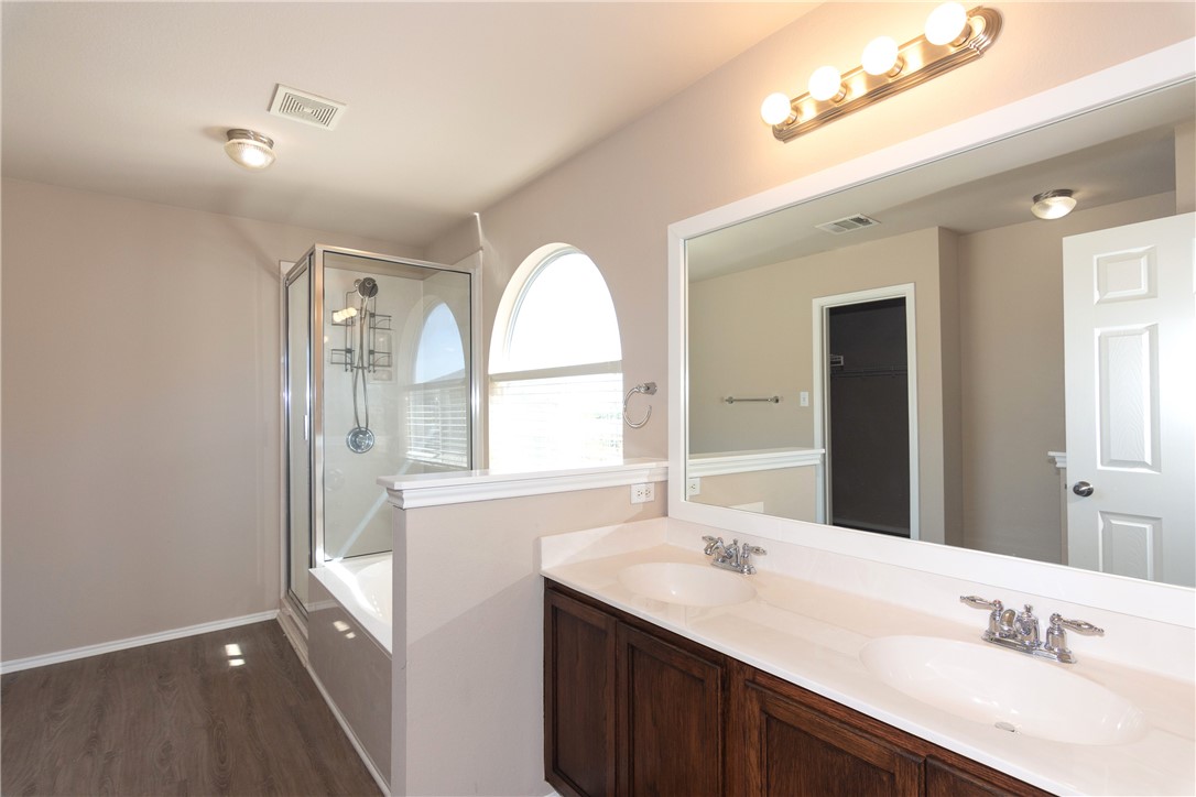2605 Summerwalk Place Round Rock, TX 78665 - Photo 20 of 37 a bathroom with a double vanity sink and a mirror