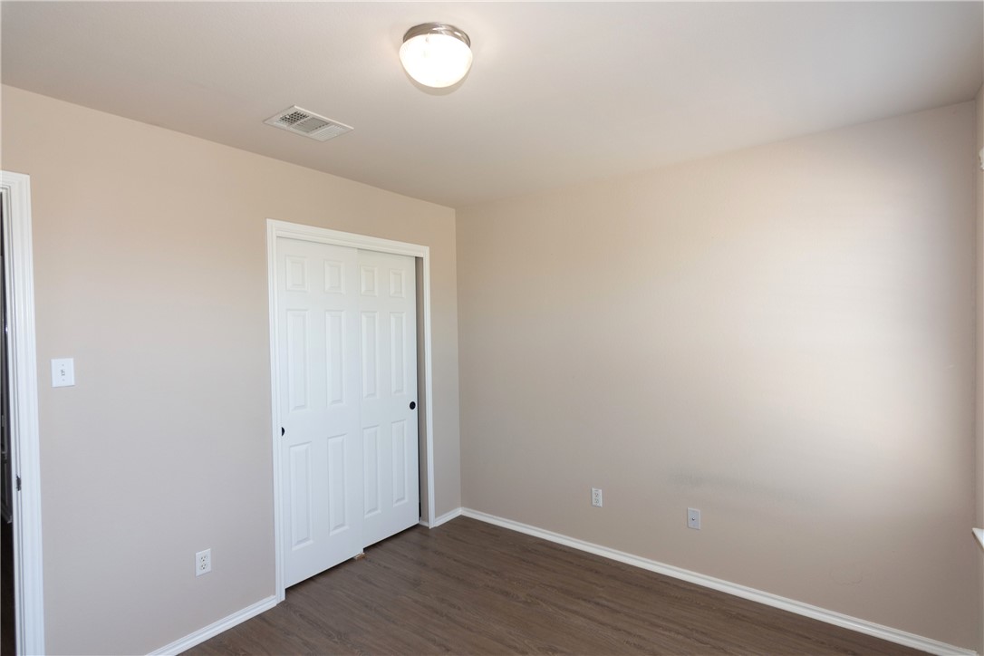 2605 Summerwalk Place Round Rock, TX 78665 - Photo 24 of 37 an empty room with wooden floor