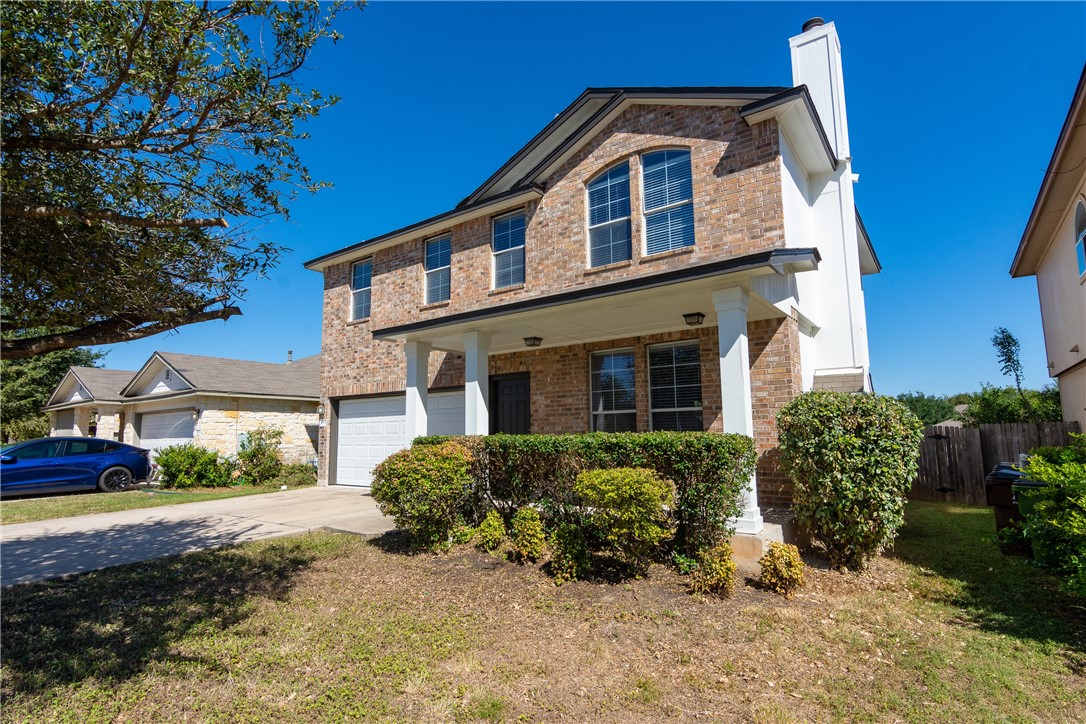 2605 Summerwalk Place Round Rock, TX 78665 - Photo 4 of 37 a front view of a house with a yard