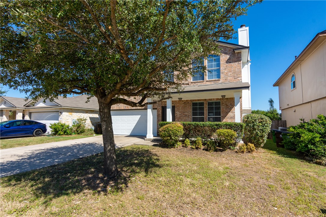 2605 Summerwalk Place Round Rock, TX 78665 - Photo 5 of 37 a front view of a house with garden