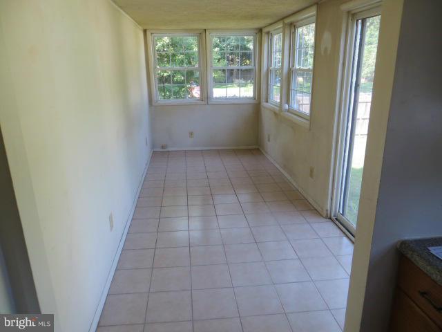8243 Old Mill Road Pasadena, MD 21122 - Photo 10 of 15 Interior patio