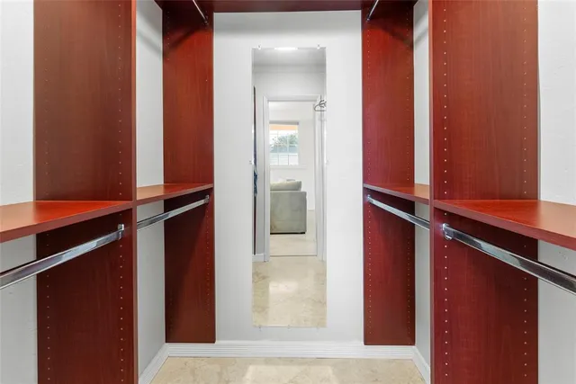 a bathroom with a toilet a sink and a mirror