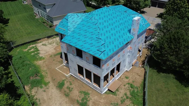 an aerial view of a house with roof yard