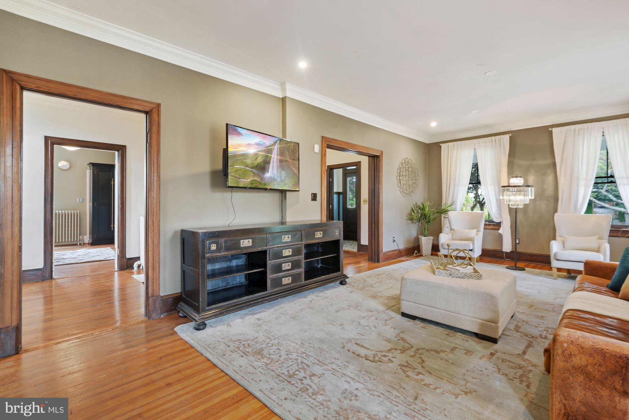 6812 Connecticut Avenue Chevy Chase, MD 20815 - Photo 5 of 37 Living room has original pine floors