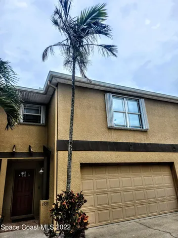 a potted plant sitting on the roof of a house