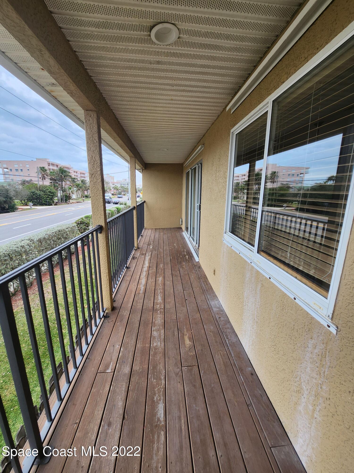 1953 Cato Court, Unit 6 Indialantic, FL 32903 - Photo 2 of 18 a view of balcony with wooden floor