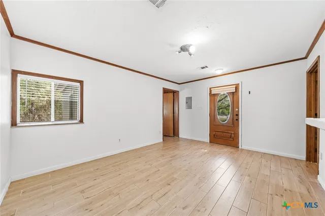a view of an empty room with a window