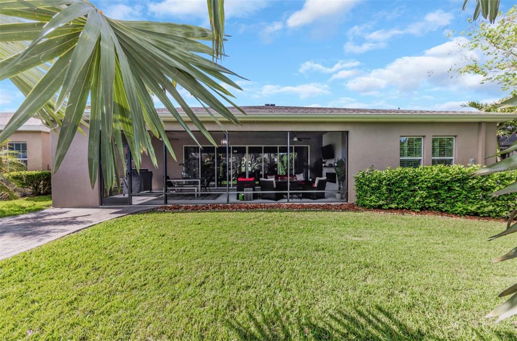 6916 Neopolitan Court Apollo Beach, FL 33572 - Photo 41 of 43 a swimming pool with outdoor seating and yard