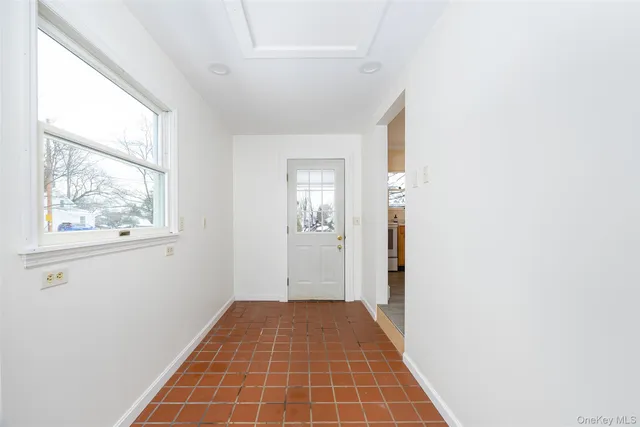 a view of hallway with windows