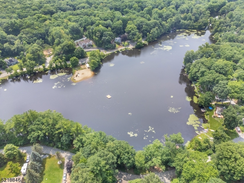 1 Clinton Road West Milford, NJ 07480 - Photo 2 of 4 an aerial view of a houses with a yard and lake view